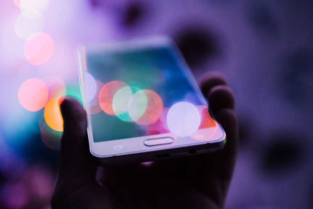 How to Withdraw Betting Winnings to M-Pesa in Kenya Person holding a smartphone to withdraw money via mobile money